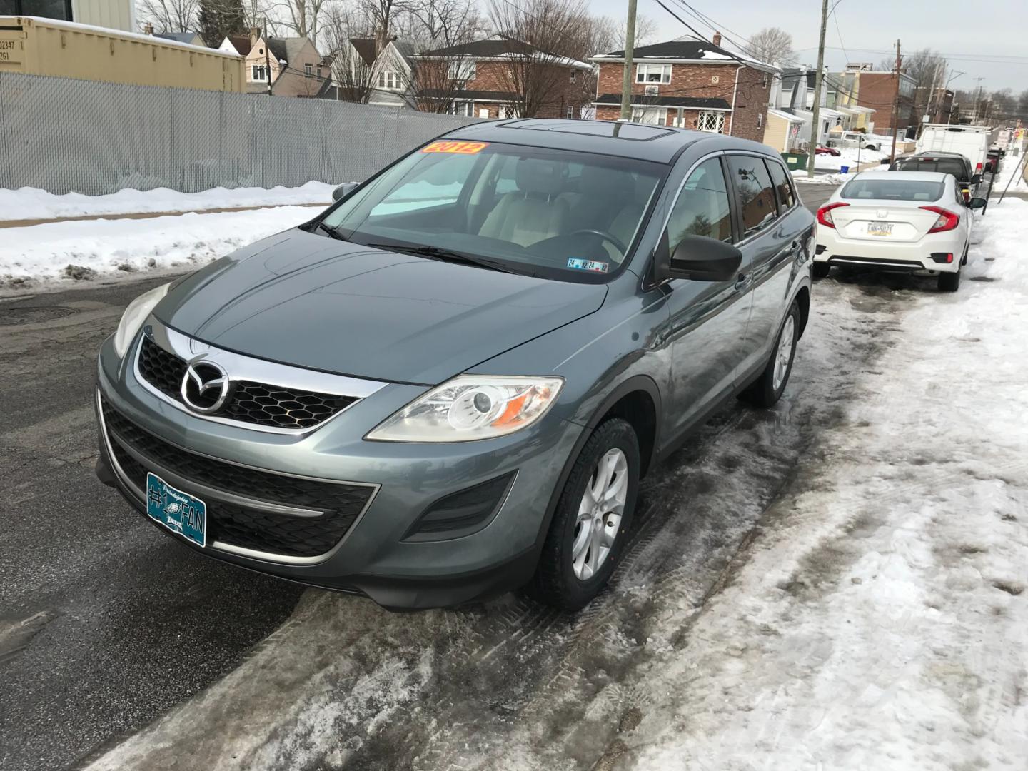 2012 Green /Tan Mazda CX-9 Sport (JM3TB3BV4C0) with an 3.7 V6 engine, Automatic transmission, located at 577 Chester Pike, Prospect Park, PA, 19076, (610) 237-1015, 39.886154, -75.302338 - Photo#3